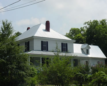 White Home with Silver Tin Roof
